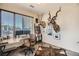 Well-lit home office featuring a large desk, unique decor, and ample natural light at 3361 Mariposa St, Denver, CO 80211