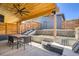 Inviting outdoor space with a covered dining area and comfortable lounge seating for relaxation and enjoyment at 3361 Mariposa St, Denver, CO 80211