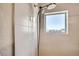 Sleek shower with modern fixtures, including a dual shower head and a bright window at 3361 Mariposa St, Denver, CO 80211