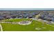 Aerial view of houses, a park, and playground in a new community at 889 Crest St, Lochbuie, CO 80603