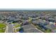 Aerial view of houses and neighborhood streets in a community at 889 Crest St, Lochbuie, CO 80603