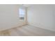 Simple bedroom with neutral carpet and a window at 889 Crest St, Lochbuie, CO 80603