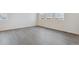 Bright dining area with hardwood floors and lots of natural light at 889 Crest St, Lochbuie, CO 80603