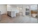 Modern kitchen with island, gray cabinets, and granite counters at 889 Crest St, Lochbuie, CO 80603