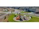 Playground in a new community with a slide and climbing structures at 889 Crest St, Lochbuie, CO 80603