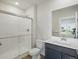 Well-lit bathroom features a glass-enclosed shower, contemporary vanity, and modern fixtures at 14536 Mellow Ct, Morrison, CO 80465