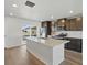 Bright kitchen featuring stainless steel appliances, a center island, and sliding glass doors at 14536 Mellow Ct, Morrison, CO 80465