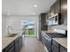 Kitchen with stainless appliances, a center island and wood-look laminate flooring at 14536 Mellow Ct, Morrison, CO 80465