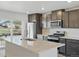 Kitchen featuring stainless appliances, granite countertops, island and sleek cabinets at 14536 Mellow Ct, Morrison, CO 80465