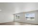 Bright living room with hardwood floors, recessed lighting, and scenic views from the large windows at 14536 Mellow Ct, Morrison, CO 80465