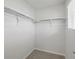 Functional walk-in closet with metal rods and shelving, perfect for organizing clothes and accessories at 14536 Mellow Ct, Morrison, CO 80465