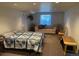 Finished basement bedroom with ample seating and relaxing decor at 9798 Grove St, Westminster, CO 80031