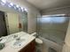 Standard bathroom featuring a shower-tub combo and neutral tile at 9798 Grove St, Westminster, CO 80031