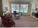 Cozy living room with large windows, fireplace, and comfortable seating at 9798 Grove St, Westminster, CO 80031