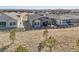Expansive backyard featuring a spacious patio, stone landscaping, and wooden fence at 6759 Canyonpoint Rd, Castle Pines, CO 80108