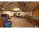 Unfinished basement with exposed pipes, window, and plenty of room for storage at 6759 Canyonpoint Rd, Castle Pines, CO 80108
