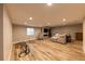 Spacious finished basement with wood floors, fireplace, and room for a play area at 6759 Canyonpoint Rd, Castle Pines, CO 80108