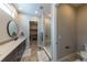 This modern bathroom offers a glass shower and a dual sink vanity with lots of storage at 6759 Canyonpoint Rd, Castle Pines, CO 80108