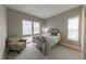 Comfortable bedroom with a queen-size bed, neutral tones, and ample natural light at 6759 Canyonpoint Rd, Castle Pines, CO 80108