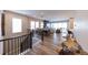 Open concept living room and dining area with hardwood floors at 6759 Canyonpoint Rd, Castle Pines, CO 80108