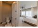 A partial view of a main bedroom with an ensuite toilet room for added privacy at 6759 Canyonpoint Rd, Castle Pines, CO 80108