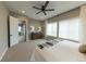 Bright main bedroom featuring large windows, neutral tones, and a serene atmosphere perfect for rest and relaxation at 6759 Canyonpoint Rd, Castle Pines, CO 80108