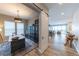 Stylish office featuring a sliding barn door, a large wooden desk, and a black bookcase, perfect for a home workspace at 6759 Canyonpoint Rd, Castle Pines, CO 80108