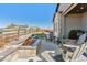 Charming outdoor fireplace with patio seating and lush green grass, perfect for summer nights at 6759 Canyonpoint Rd, Castle Pines, CO 80108