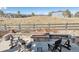 Cozy outdoor fireplace and seating, creating a perfect setting for entertaining and relaxation at 6759 Canyonpoint Rd, Castle Pines, CO 80108