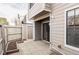 Backyard patio area with privacy fence and sliding glass door at 8787 Yukon St, Arvada, CO 80005