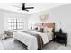 Bright bedroom features a ceiling fan, and a large window that provides great natural light at 8787 Yukon St, Arvada, CO 80005