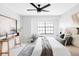 Bright bedroom features a ceiling fan, a large window that provides great natural light, and modern decor at 8787 Yukon St, Arvada, CO 80005