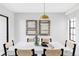 Dining area features contemporary lighting, a large table, and modern decor at 8787 Yukon St, Arvada, CO 80005