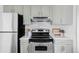 Well-equipped kitchen with stainless steel appliances and sleek, modern cabinets at 8787 Yukon St, Arvada, CO 80005