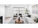 Cozy living area with a large window, comfortable seating, and contemporary decor at 8787 Yukon St, Arvada, CO 80005