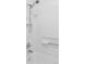 Bright shower features a showerhead and white tiled walls for a clean and fresh look at 8787 Yukon St, Arvada, CO 80005