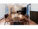 Spacious dining area with hardwood floors and a charming table at 1608 Beaver Brook Canyon Rd, Evergreen, CO 80439