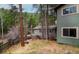 Charming exterior with mature trees and rustic charm nestled in a serene wooded setting at 1608 Beaver Brook Canyon Rd, Evergreen, CO 80439