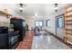 Open-concept kitchen featuring new appliances, tile flooring, and bright lighting at 1608 Beaver Brook Canyon Rd, Evergreen, CO 80439