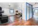 Bright living room with hardwood floors, an antique stove, and a cozy seating area at 1608 Beaver Brook Canyon Rd, Evergreen, CO 80439