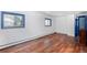 Spacious living room showcasing laminate wood floors, natural light, and a neutral color scheme at 1608 Beaver Brook Canyon Rd, Evergreen, CO 80439