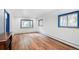 Bright living room featuring laminate floors, recessed lighting and natural light from the large windows at 1608 Beaver Brook Canyon Rd, Evergreen, CO 80439