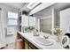 Bright bathroom with large mirror, double sinks, and modern decor at 4781 S Grant St, Englewood, CO 80113