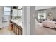 Bright bathroom with large mirror, double sinks, and a view to a decorated bedroom at 4781 S Grant St, Englewood, CO 80113