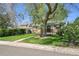 Quaint home with a well-maintained front yard featuring a lush lawn and mature trees at 4781 S Grant St, Englewood, CO 80113