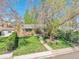 Charming home with a well-manicured lawn, mature trees, and inviting curb appeal at 4781 S Grant St, Englewood, CO 80113