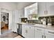 Bright kitchen showcases modern appliances, marble counters, and subway tile backsplash at 4781 S Grant St, Englewood, CO 80113