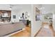 Spacious living room featuring a fireplace, hardwood floors, and an open layout with a view to the entry at 4781 S Grant St, Englewood, CO 80113