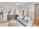 Living room with modern furnishings, neutral paint, with hardwood flooring creating a cozy atmosphere at 4781 S Grant St, Englewood, CO 80113