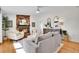 Bright living room featuring hardwood floors, a fireplace, comfortable seating, and tasteful decor at 4781 S Grant St, Englewood, CO 80113